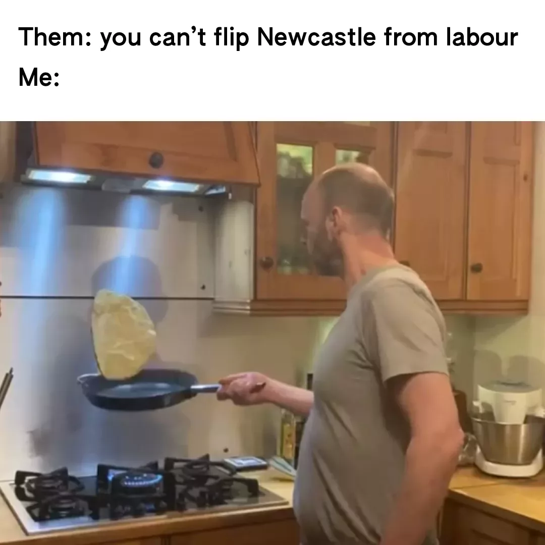 Man expertly flipping a pancake in the kitchen as a metaphor for defying expectations.