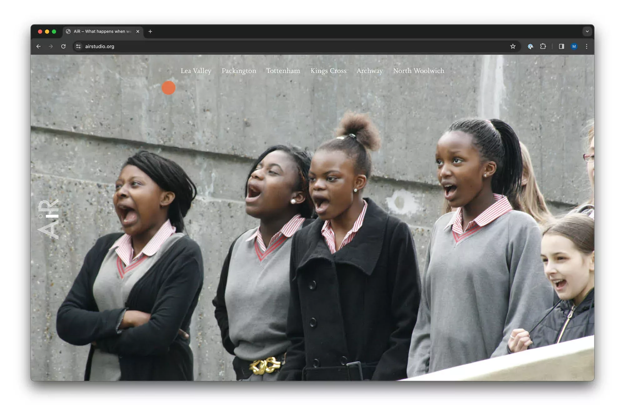 A group of schoolgirls expressing surprise and excitement, with mouths wide open, likely watching an event or performance.
