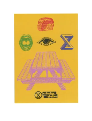 A vibrant graphic poster with a central illustration of a purple wooden picnic table on a yellow background, flanked by symbols – a red fist, a green hourglass inside a circle, a blue 'x', and an eye – representing various aspects of activism, with the "extinction rebellion" logo at the bottom.