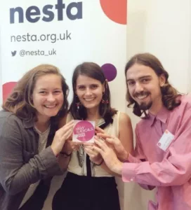 3 people hold a nesta new radicals award