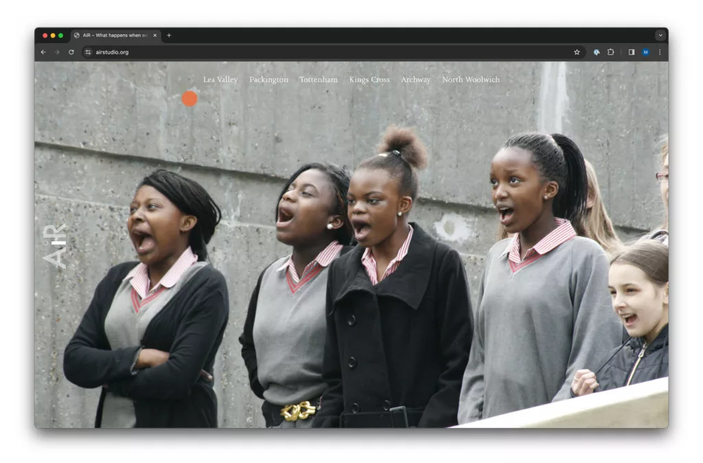 A group of schoolgirls expressing surprise and excitement, with mouths wide open, likely watching an event or performance.