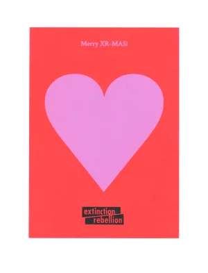 Christmas greeting card with a bold pink heart on a red background, featuring the message "merry xr-mas!" and the extinction rebellion logo at the bottom.